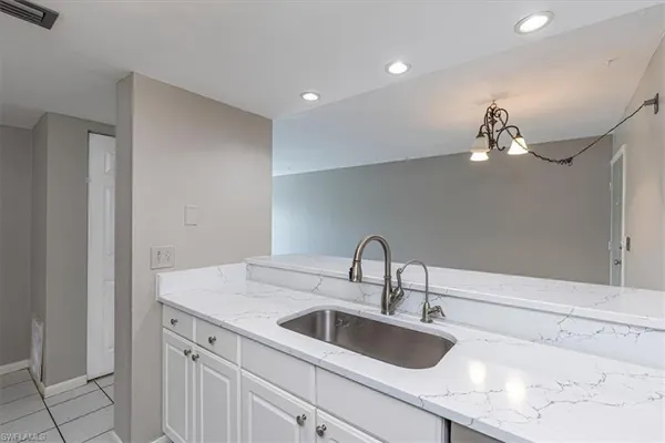 a close view of a sink and a vanity in the bathroom