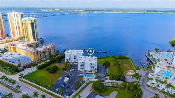 an aerial view of a house with a swimming pool yard and outdoor seating