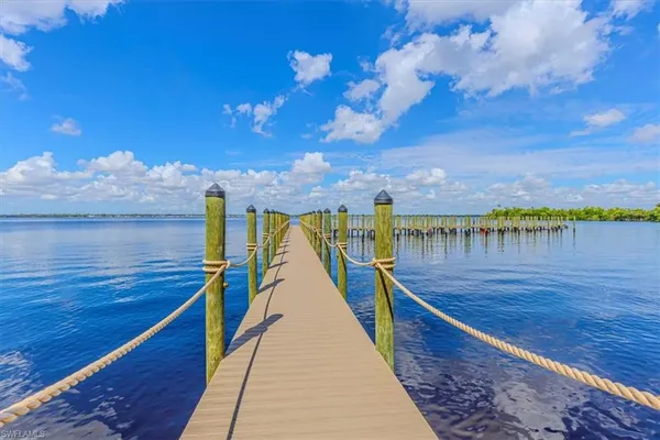 a view of a swimming pool with an outdoor space and seating area