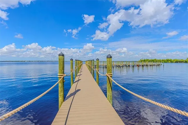 a view of a swimming pool with an outdoor space and seating area