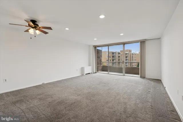 a view of an empty room with a window