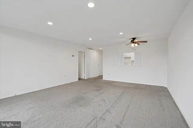 a kitchen with cabinets a stove a sink and a refrigerator