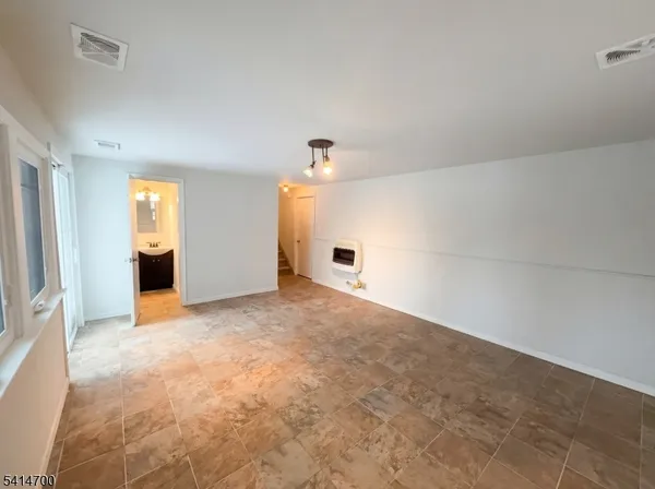 a view of empty room with windows