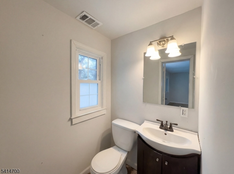 78 Parkside Road Plainfield, NJ 07060 - Photo 19 of 29 a bathroom with a toilet sink and mirror