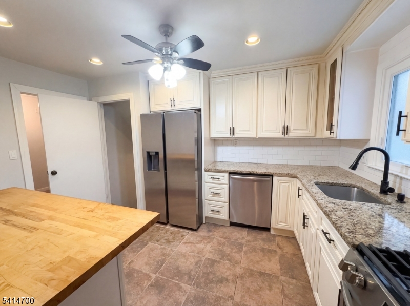 78 Parkside Road Plainfield, NJ 07060 - Photo 2 of 29 a kitchen with stainless steel appliances granite countertop a sink a stove a refrigerator and island