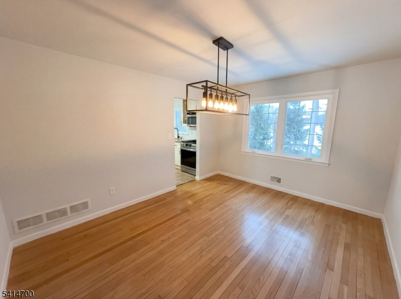 78 Parkside Road Plainfield, NJ 07060 - Photo 7 of 29 a view of empty room with wooden floor fan