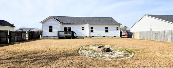 a view of a house with snow in the background