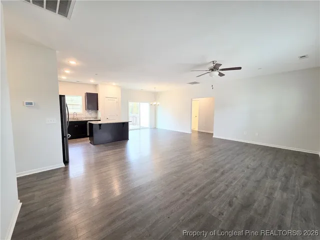 a view of a kitchen with a sink and a fireplace