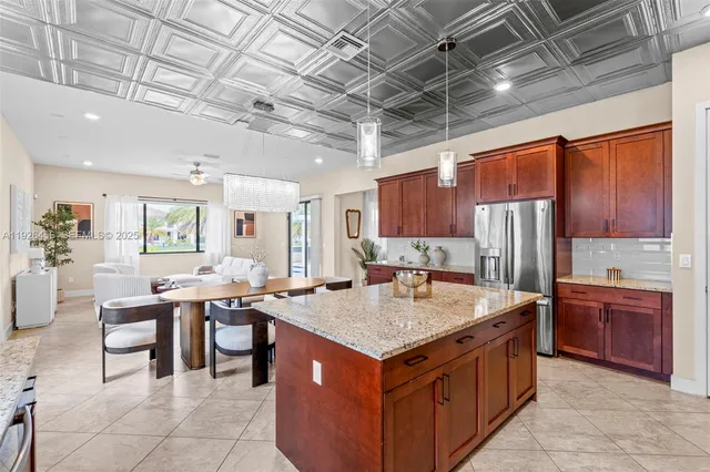 a view of a backyard with a garden and entertaining space