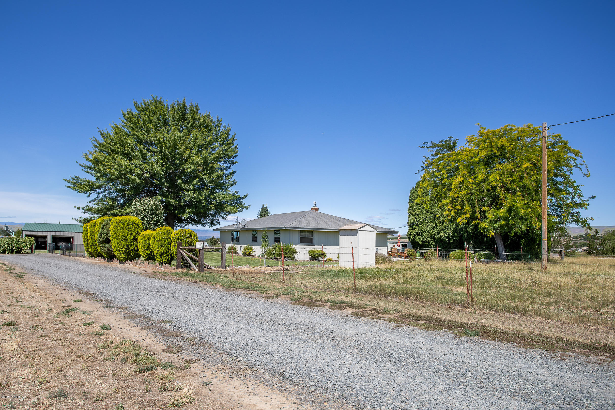 1020 Beane Road Moxee, WA 98936 - Photo 16 of 36 a view of a house with a yard and sitting area
