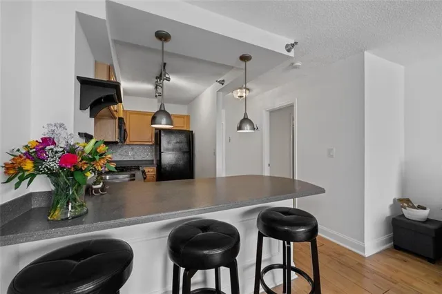 a dining room with furniture and wooden floor