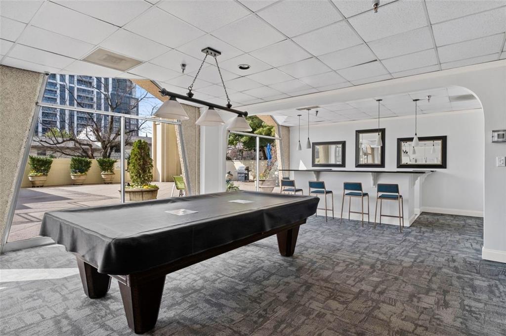 2479 Peachtree Street Northeast, Unit 912 Atlanta, GA 30305 - Photo 28 of 36 a room with pool table and windows