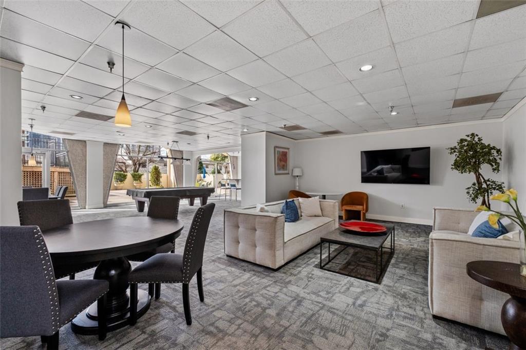 2479 Peachtree Street Northeast, Unit 912 Atlanta, GA 30305 - Photo 29 of 36 a living room with furniture and a flat screen tv