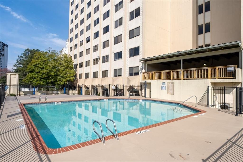 2479 Peachtree Street Northeast, Unit 912 Atlanta, GA 30305 - Photo 31 of 36 a view of a swimming pool with a patio