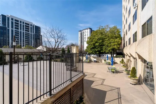 a view of a balcony with chairs