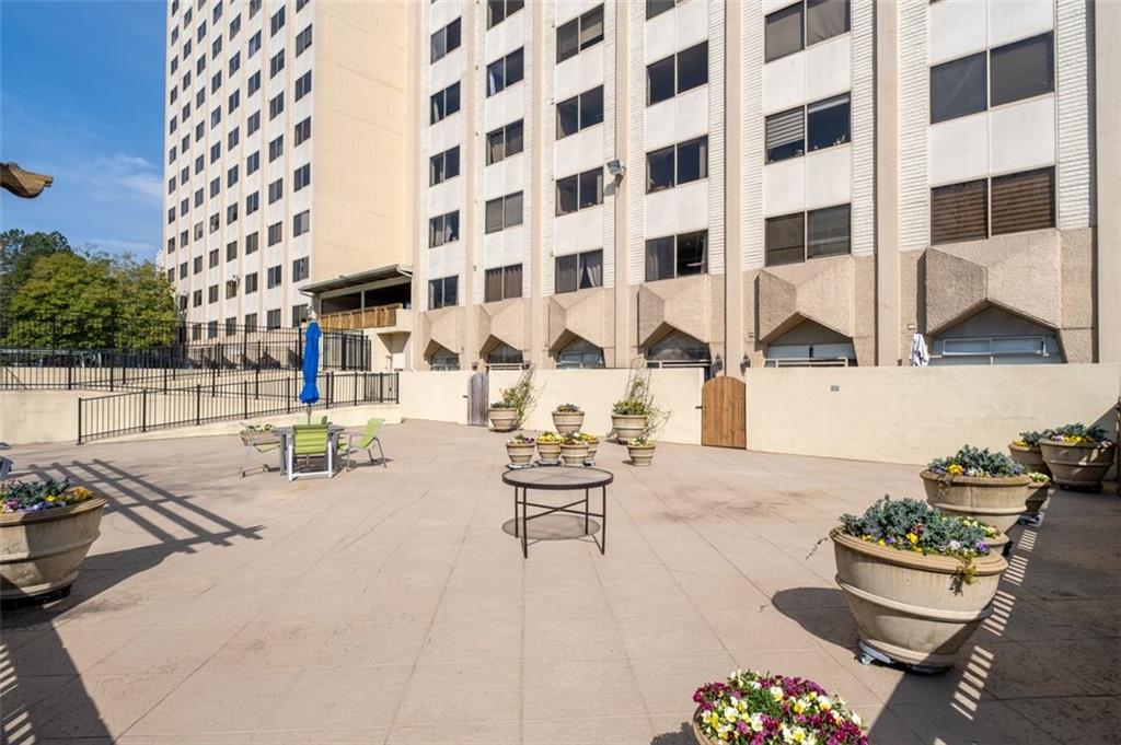 2479 Peachtree Street Northeast, Unit 912 Atlanta, GA 30305 - Photo 35 of 36 a view of a patio with couches and potted plants