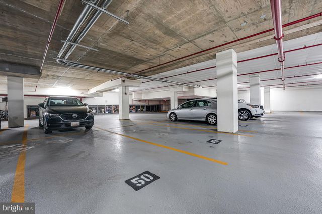 a view of parking space with parked cars