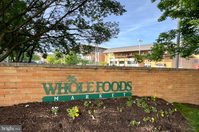 a picture of a bench in front of a wall