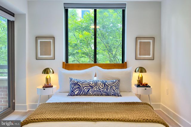 a bedroom with a bed and window