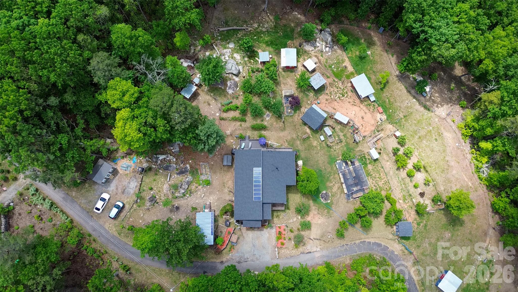 159 Volley Ellenboro, NC 28040 - Photo 25 of 37 an aerial view of a house with a yard and garden