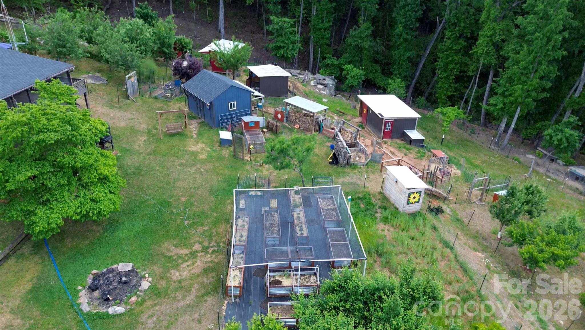159 Volley Ellenboro, NC 28040 - Photo 29 of 37 an aerial view of a house with a garden and lake view