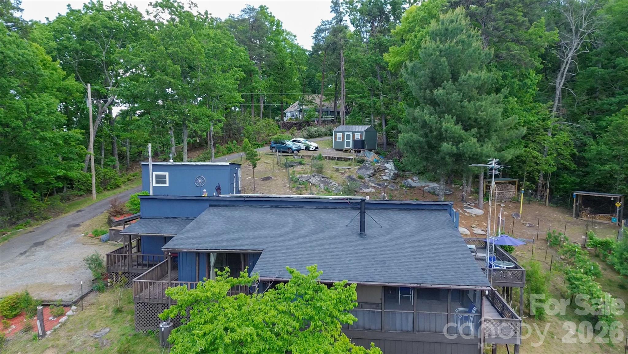 159 Volley Ellenboro, NC 28040 - Photo 30 of 37 an aerial view of a house with a yard and large trees