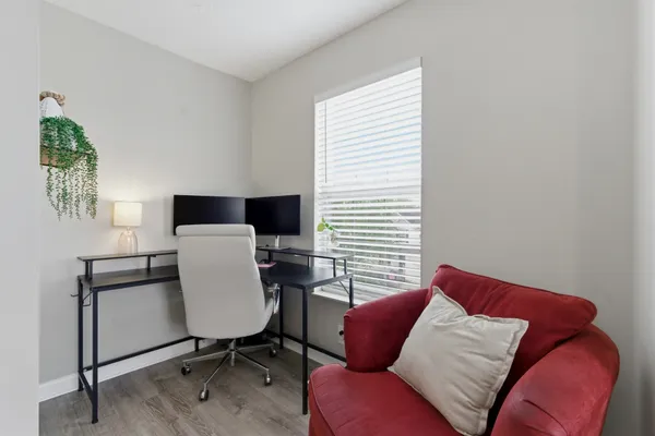 a living room with furniture and a window