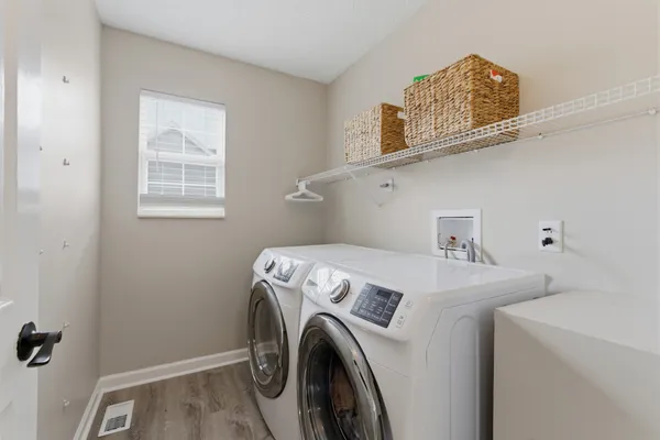 a utility room with dryer and washer