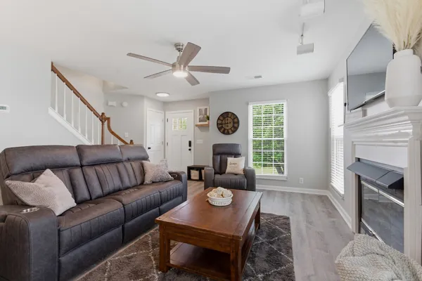 a living room with furniture and a fireplace