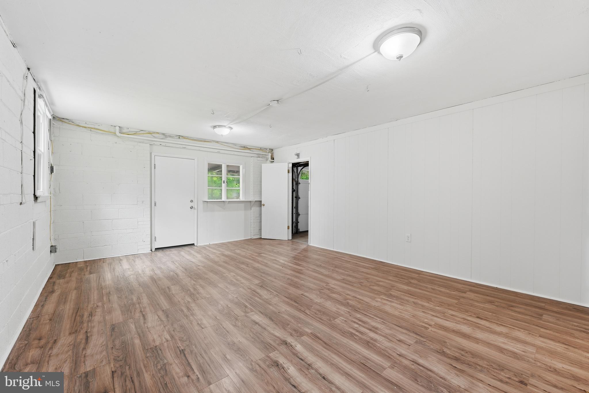 228 Northwest Terrace Silver Spring, MD 20901 - Photo 49 of 70 a view of empty room with wooden floor and ceiling fan