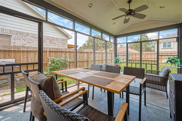 a view of a dining room with furniture window and outside view