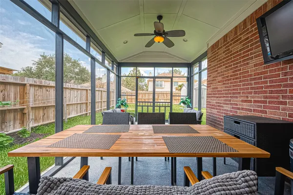 a view of a patio with a table and chairs