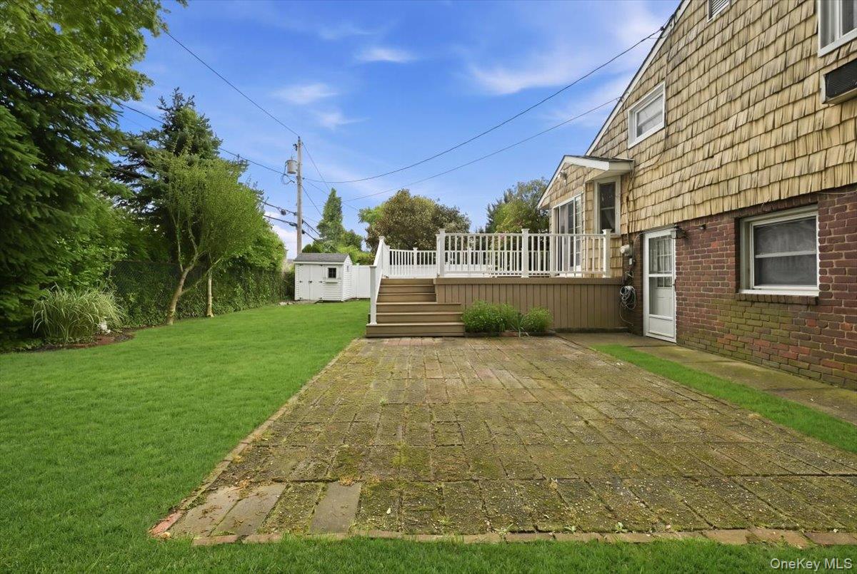 17 Avon Road Farmingdale, NY 11735 - Photo 37 of 46 a view of a backyard of the house