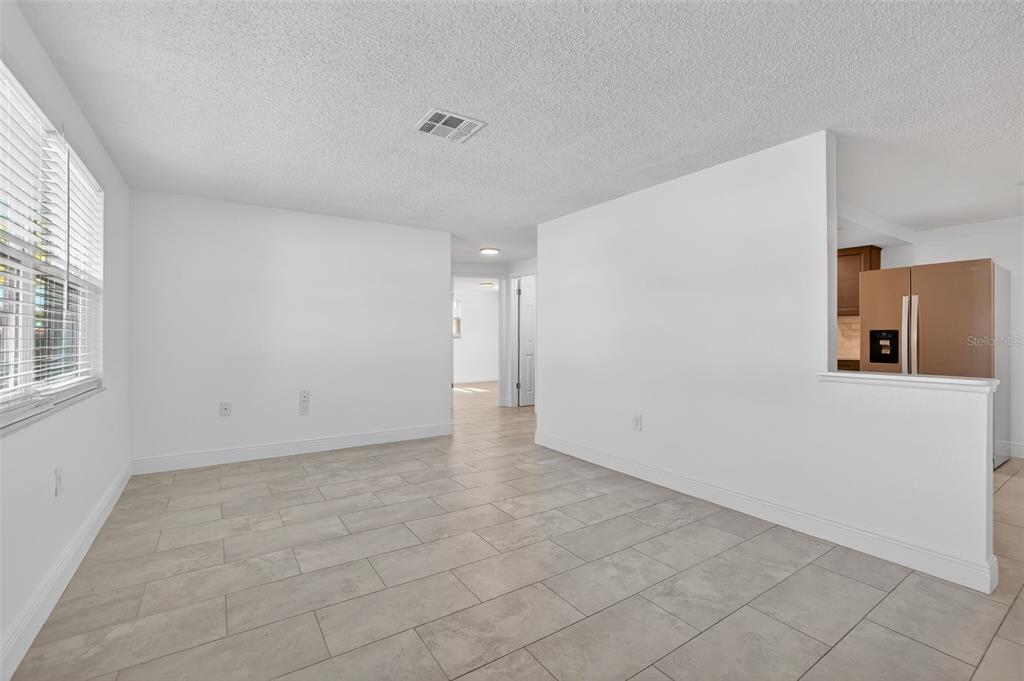 10914 Leeds Road Port Richey, FL 34668 - Photo 12 of 24 a view of a big room with windows and cabinet