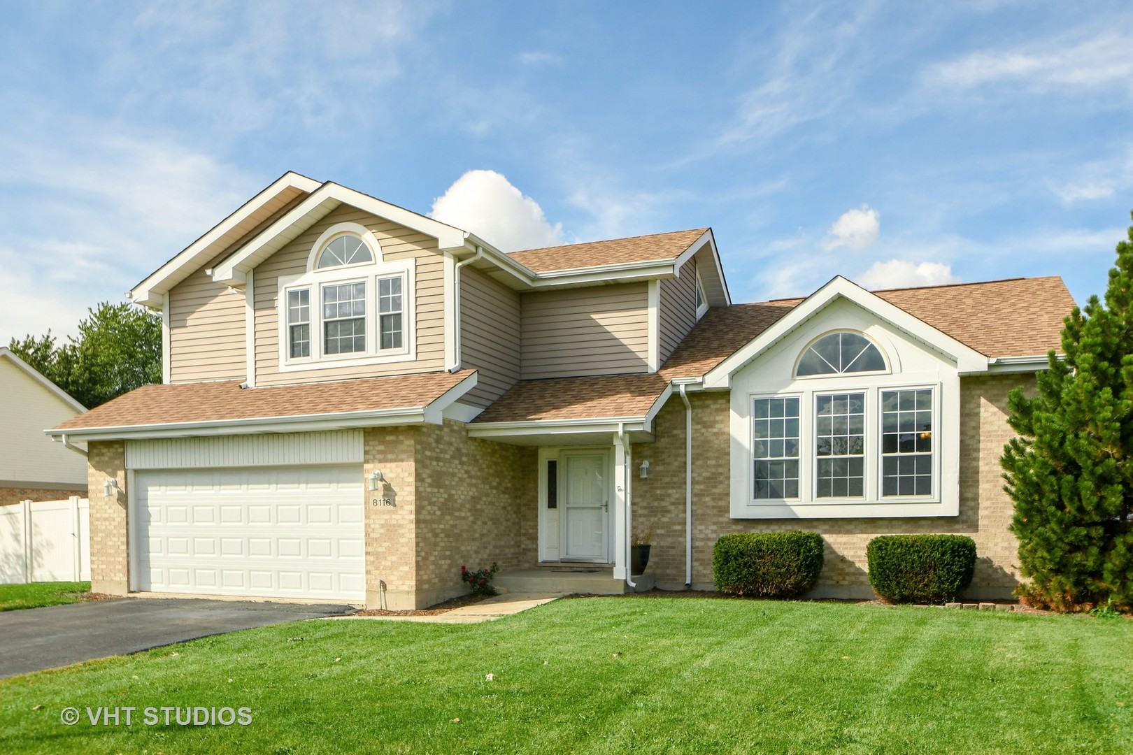 8116 Old Mill Road Frankfort, IL 60423 - Photo 1 of 16 a front view of a house with a yard and garage