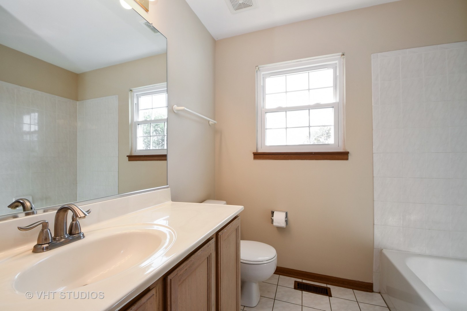 8116 Old Mill Road Frankfort, IL 60423 - Photo 13 of 16 a bathroom with a sink a toilet and window