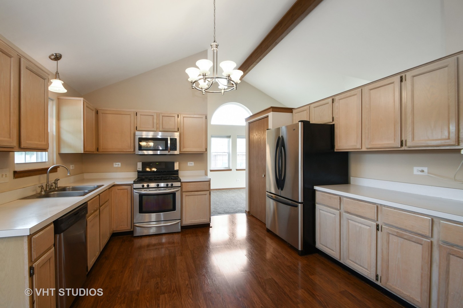 8116 Old Mill Road Frankfort, IL 60423 - Photo 4 of 16 a kitchen with stainless steel appliances granite countertop a refrigerator a stove a sink and white cabinets