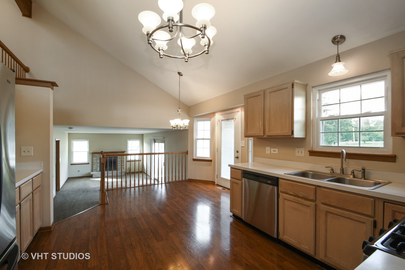 8116 Old Mill Road Frankfort, IL 60423 - Photo 5 of 16 a kitchen with stainless steel appliances granite countertop a sink window and wooden floor