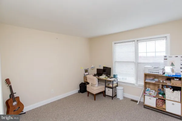 a playing room with toys and a book shelf