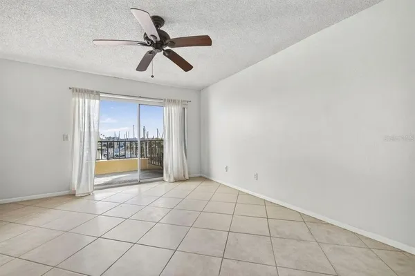 a view of an empty room and a window