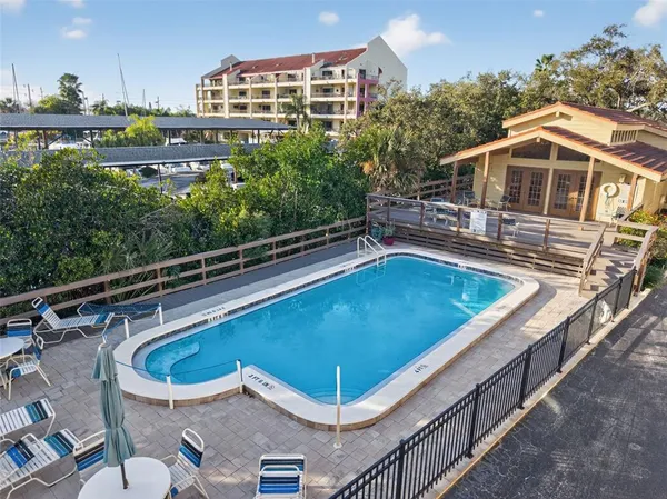 a view of a swimming pool with a lounge chairs