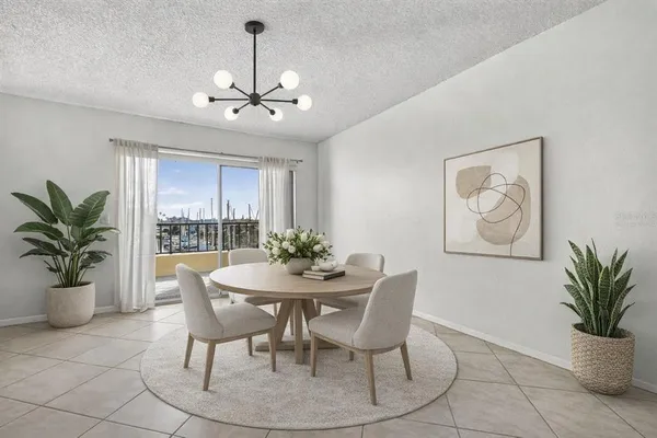 a view of a dining room with furniture window and flowerpot