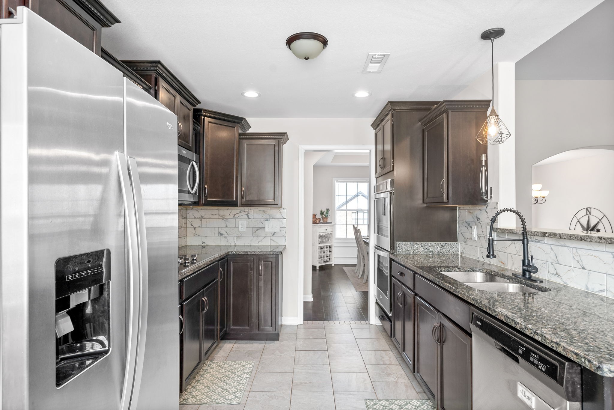 1478 Raven Road Clarksville, TN 37042 - Photo 11 of 42 a kitchen with stainless steel appliances granite countertop a sink and a refrigerator