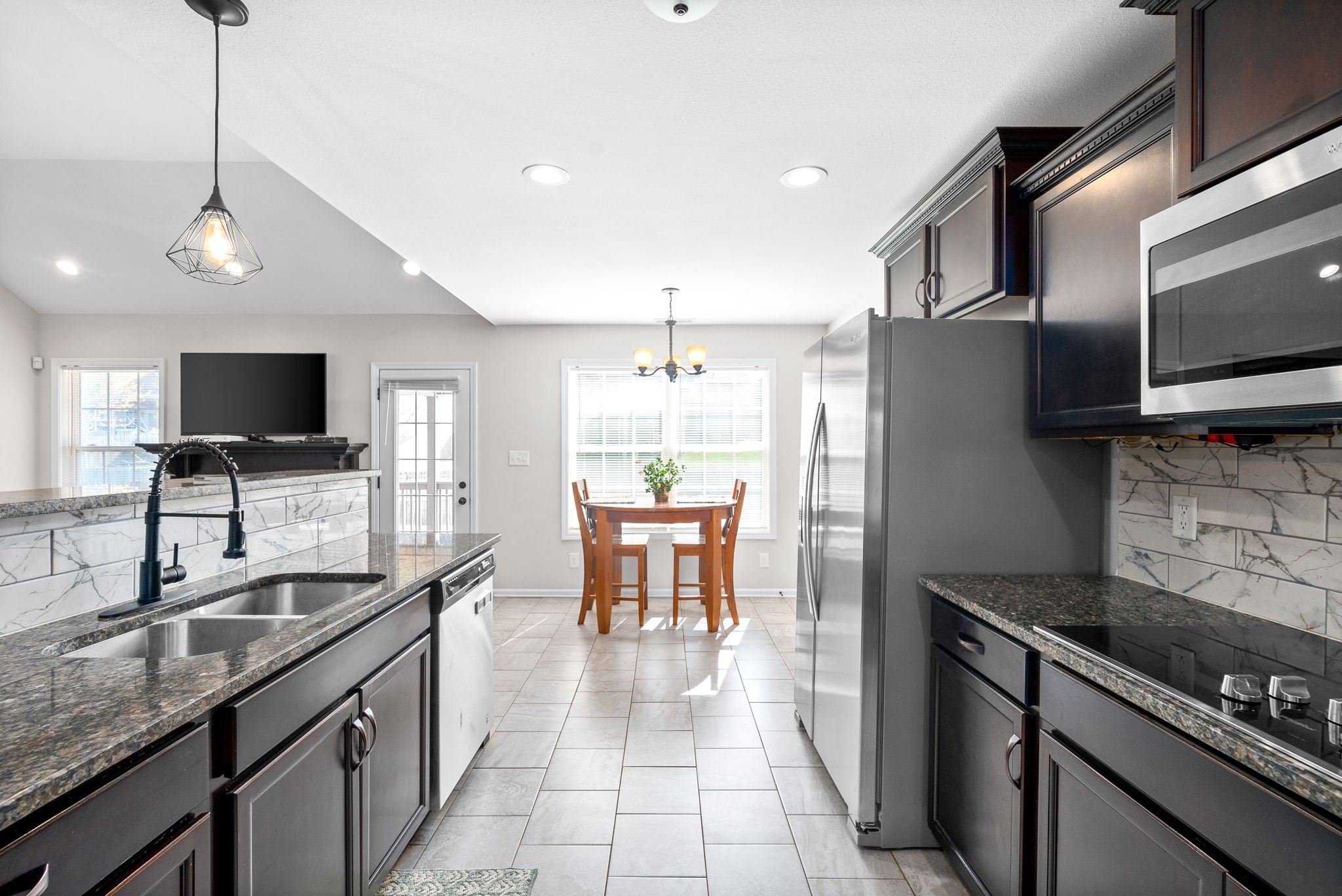 1478 Raven Road Clarksville, TN 37042 - Photo 14 of 42 a kitchen with granite countertop a sink appliances and cabinets