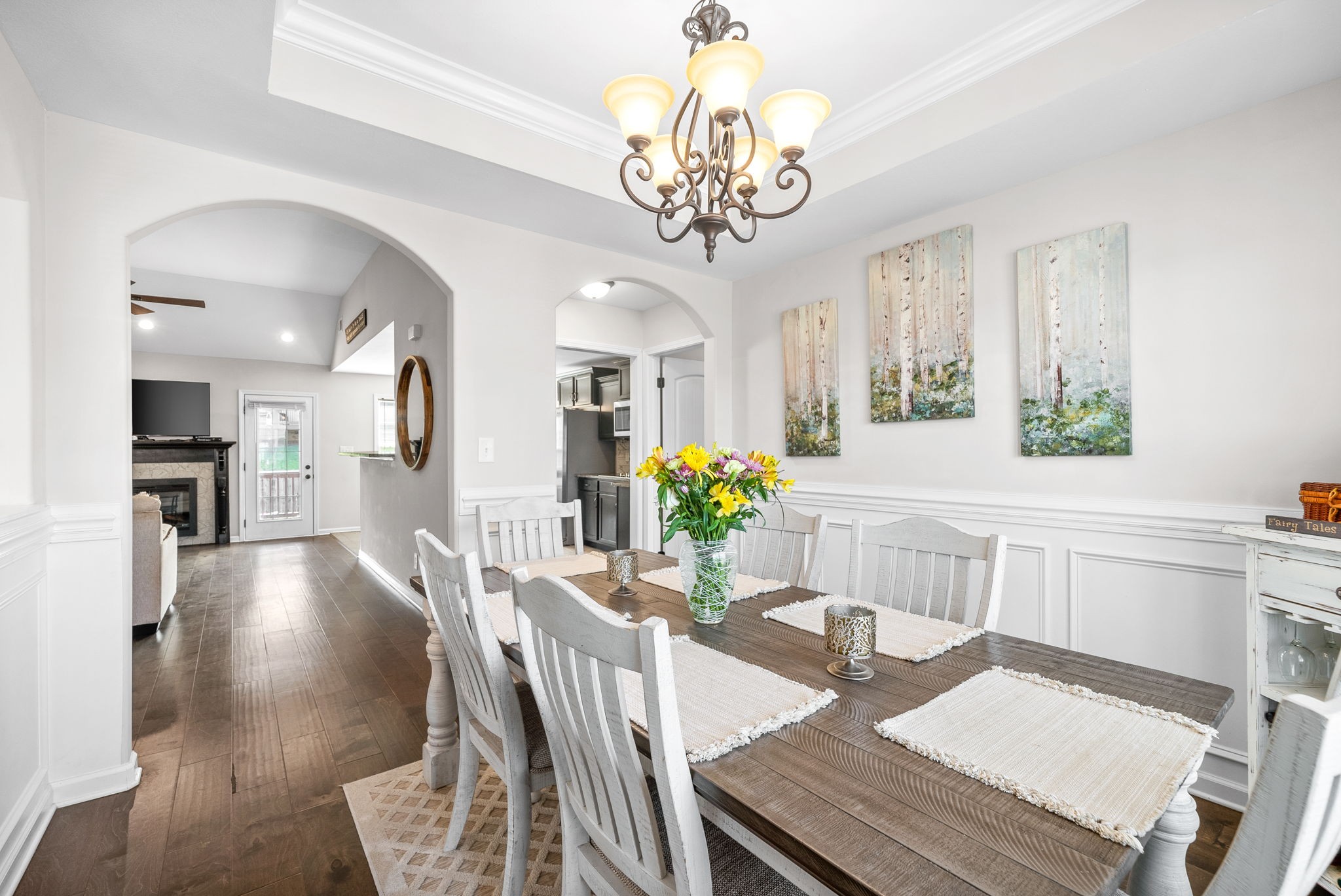 1478 Raven Road Clarksville, TN 37042 - Photo 16 of 42 a view of a dining room with furniture a chandelier and wooden floor