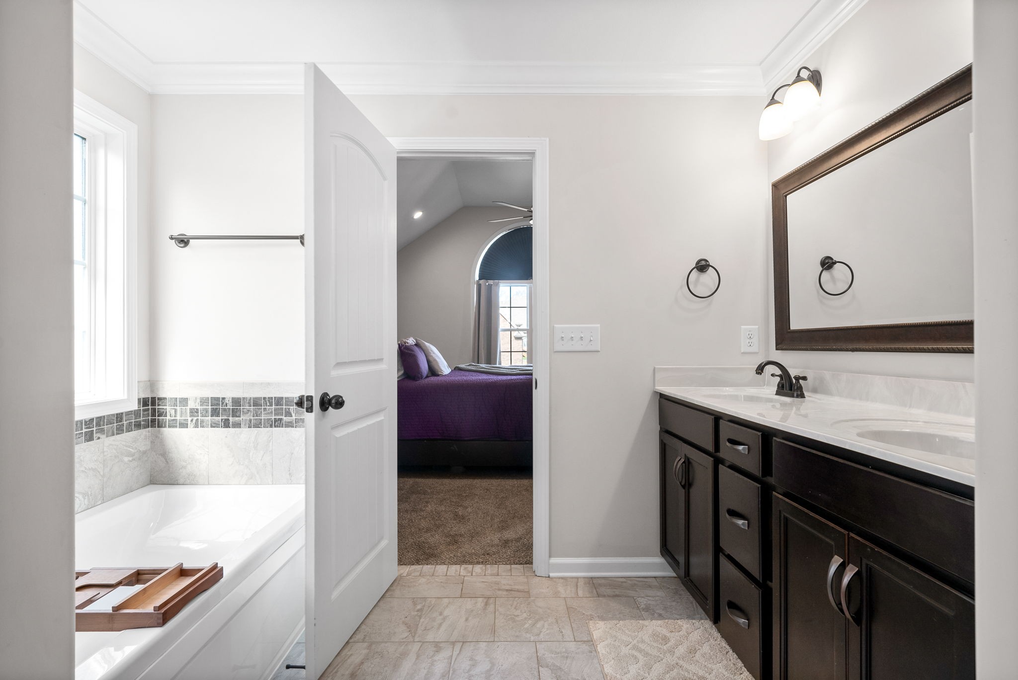 1478 Raven Road Clarksville, TN 37042 - Photo 21 of 42 a spacious bathroom with a tub sink and mirror
