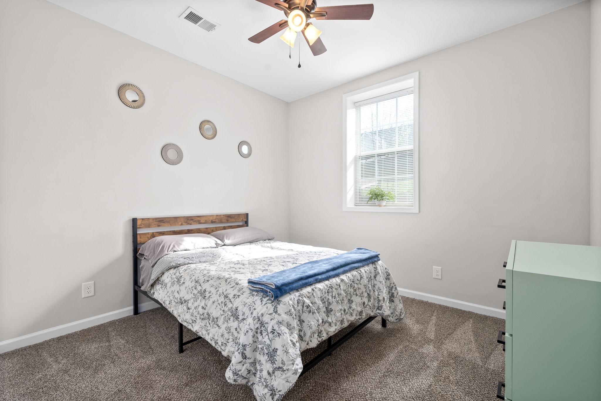 1478 Raven Road Clarksville, TN 37042 - Photo 33 of 42 a bed sitting in a bedroom next to a window