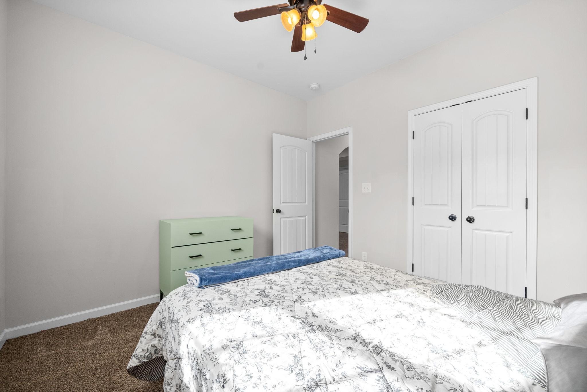 1478 Raven Road Clarksville, TN 37042 - Photo 34 of 42 a bedroom with a bed and a chandelier