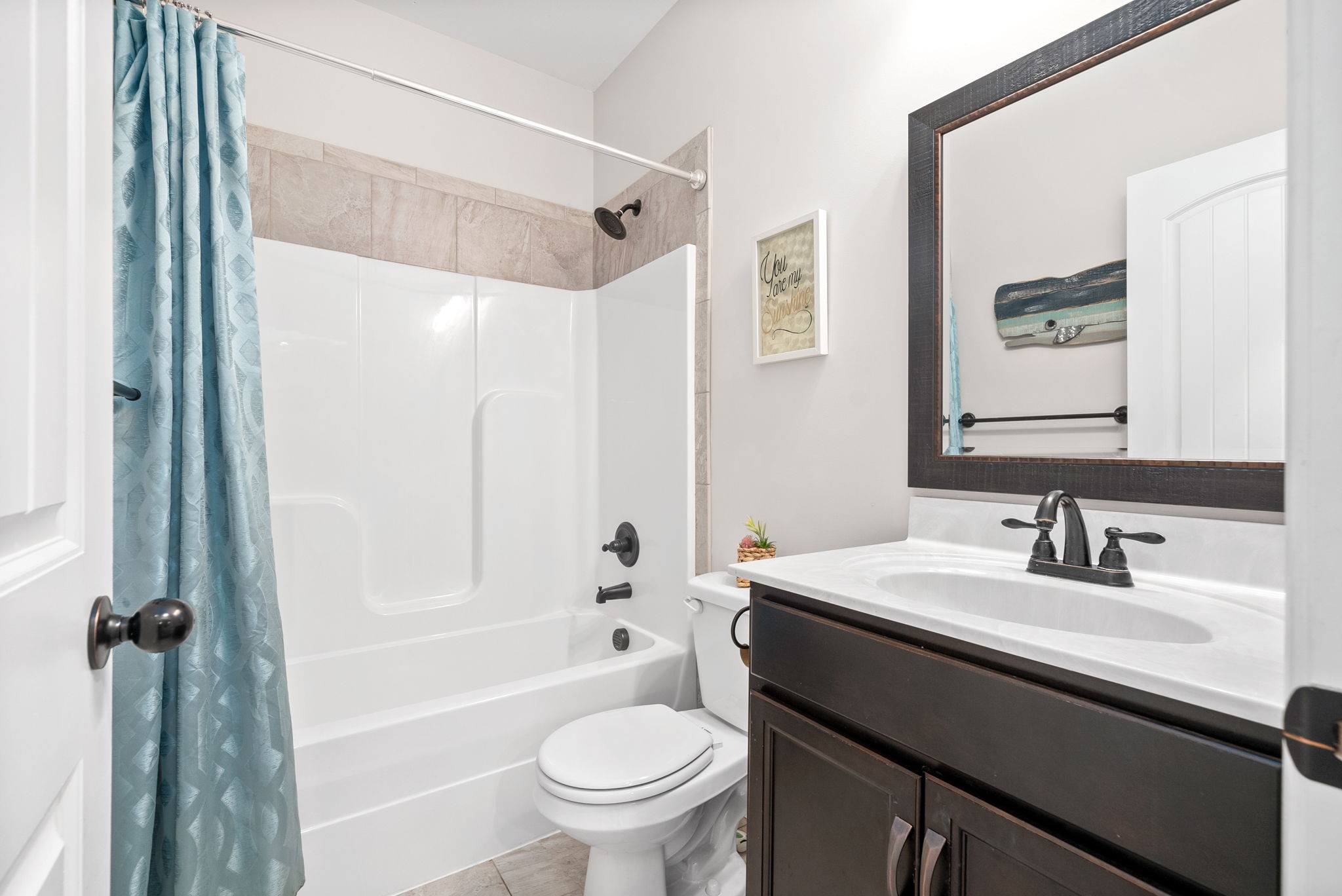 1478 Raven Road Clarksville, TN 37042 - Photo 35 of 42 a bathroom with a sink a toilet a mirror a vanity and shower