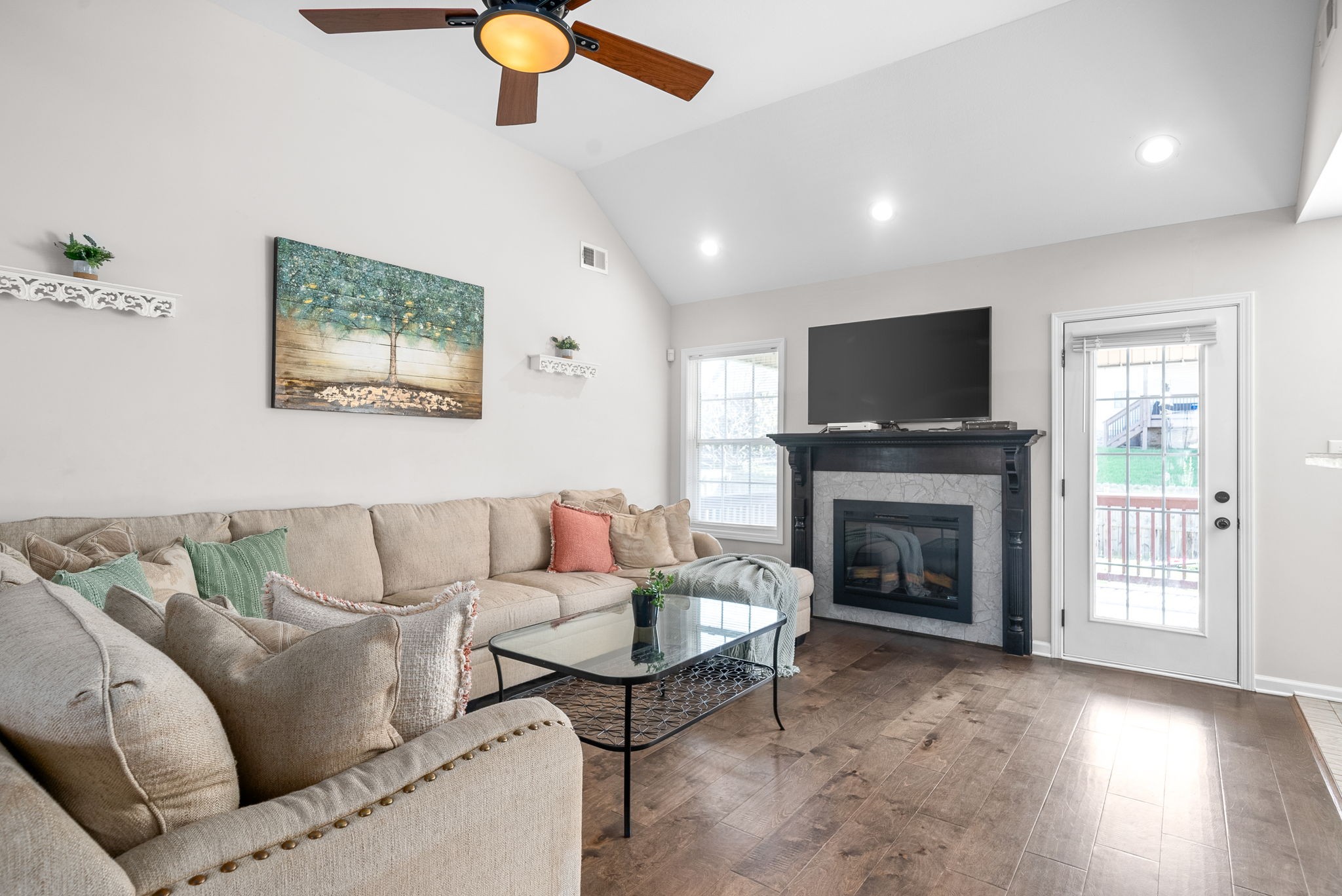1478 Raven Road Clarksville, TN 37042 - Photo 6 of 42 a living room with furniture a flat screen tv and a fireplace